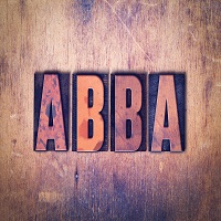 Abba Theme Letterpress Word on Wood Background